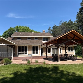 Rear of River Falls home before asphalt shingle roof replacement