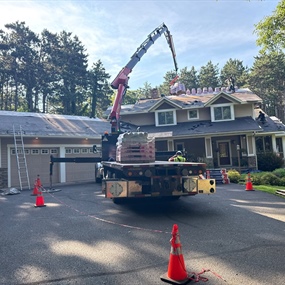 Roofing crew completing roof replacement on River Falls, WI home