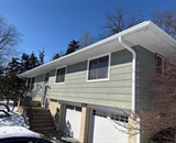 Existing siding on River Falls home before LP SmartSide installation