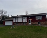 Home before seamless vinyl siding transformation near Hudson, WI
