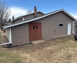New vinyl siding installed on garage exterior near Hudson, WI