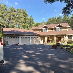 Front view of home before roof replacement in River Falls, WI