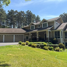 Existing shingle roof before replacement on River Falls home